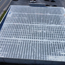 10-Year-Uniflex-Acrylic-Waterproof-System-over-the-metal-roof-at-Roses-in-Alma-GA 0