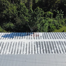 10-Year-Uniflex-Acrylic-Waterproof-System-over-the-metal-roof-at-Russell-Hilton-Cabinet-Shop-in-Odum-GA 0